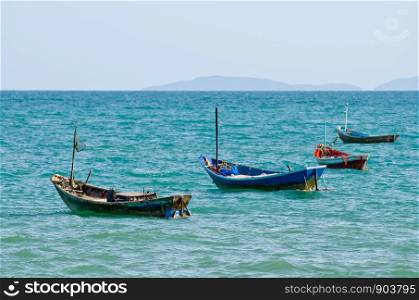 4 fisherman boats in sea with copy space