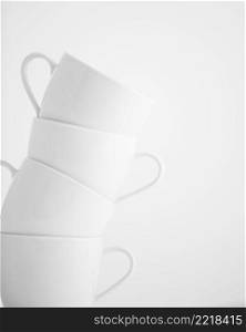 4 stacked cups in white, high key