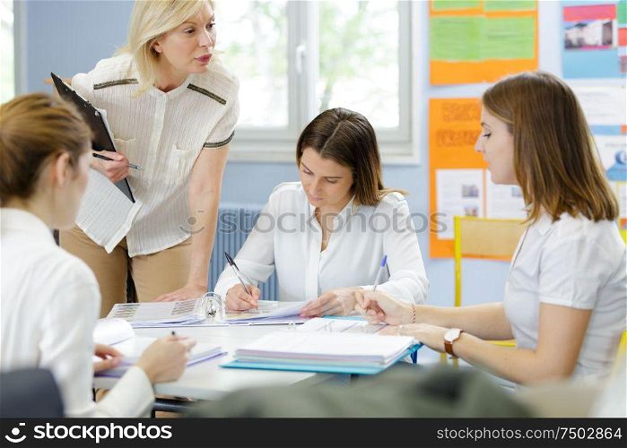4 women in a classroom