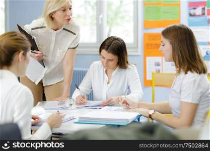 4 women in a classroom