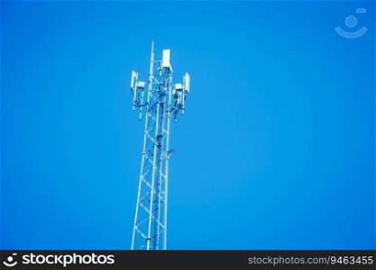 4G or 5G mobile station antenna cell site against on blue sky