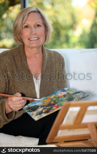 50 years old woman painting