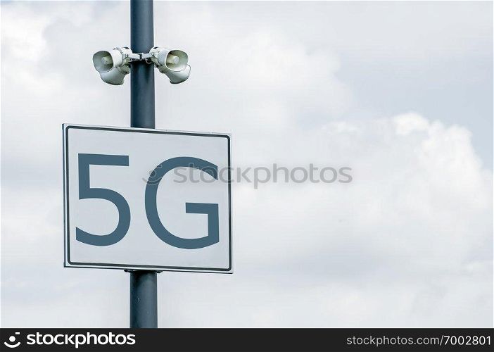 5G annotation on signboard and loudspeakers. High speed mobile internet. 5G zone.