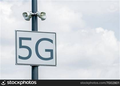 5G annotation on signboard and loudspeakers. High speed mobile internet. 5G zone.
