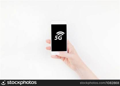 5G network, high-speed mobile Internet, new generation networks concept. Woman hand holding smartphone on white background with copy space. Template for feminine blog social technological media