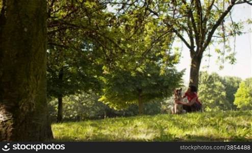 5of15 Young people and pets, portrait of hispanic woman working as dog sitter with german shepherd dog in park