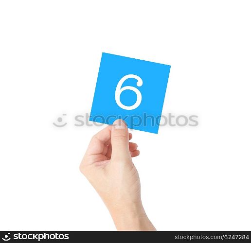 6 written on a card held by a hand