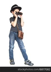 7 years old Asian traveler boy is standing and using binoculars isolated on white background