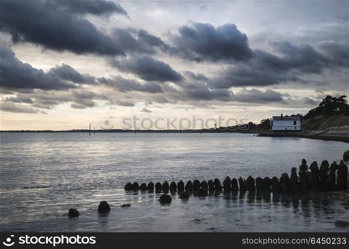 71441386 - beautiful sea landscape looking across solent to isle of wight in england with moody dramatic sunset sky