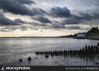 71441386 - beautiful sea landscape looking across solent to isle of wight in england with moody dramatic sunset sky