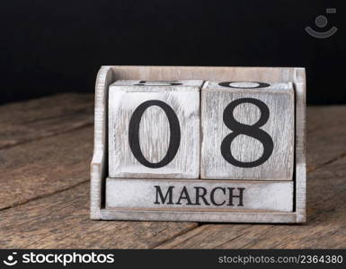 8 March Happy Women&rsquo;s Day message with wooden block calendar