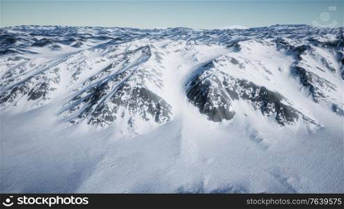 8K Aerial Landscape of snowy mountains and icy shores in Antarctica