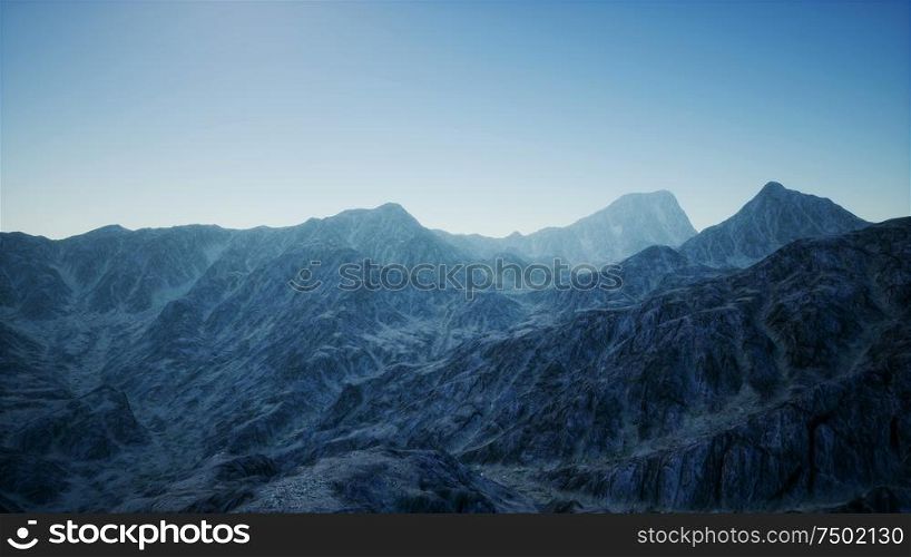 8K aerial mountain landscape in high altitude with rays of light. 8K Aerial Mountain Landscape in High Altitude
