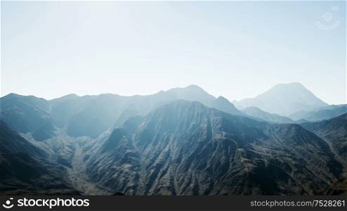 8K aerial mountain landscape in high altitude with rays of light. 8K Aerial Mountain Landscape in High Altitude
