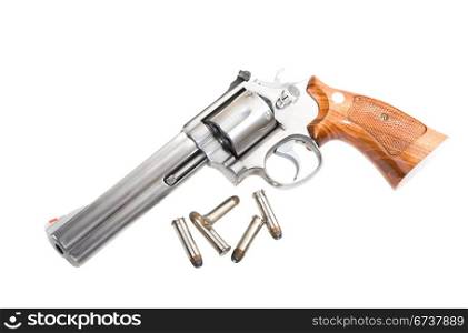 A 357 magnum revolver with bullets isolated on white