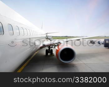 A airliner in an airport terminal;