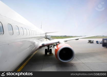 A airliner in an airport terminal;