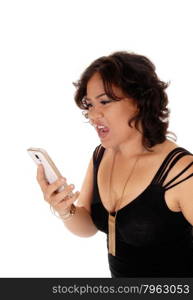 A angry young mixed raced woman holding her cell phone and shoutingat it, isolated for white background.