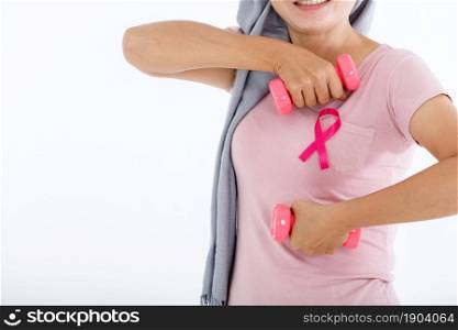 a asian woman in with pink breast cancer awareness ribbon hold a dumbbell isolated on pink blank copy space studio background,healthcare,medicine concept