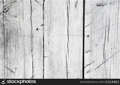 A background of closeup weathered white painted wood