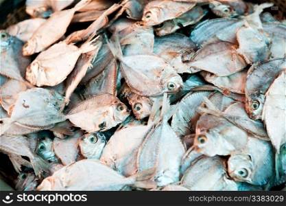 A background of dried white fish