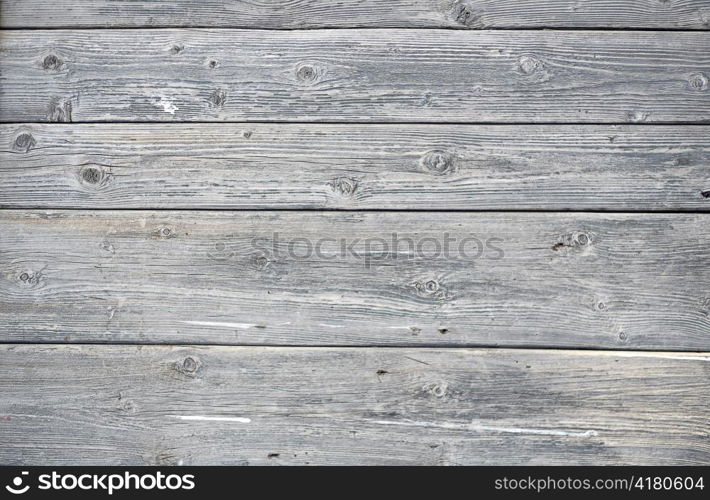 A background of weathered gray painted wood