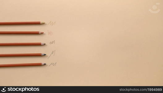 A background photo with five pencils