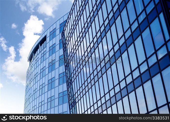A background surface of modern glass buildings.
