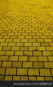 A background texture of a yellow brick road