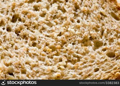A background texture of freshly sliced brown bread
