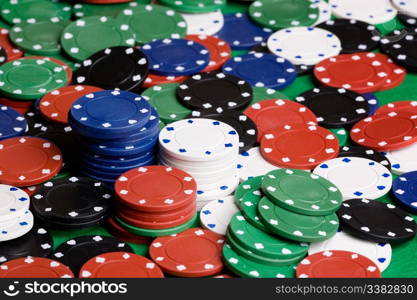 A background with casino chips of many colors