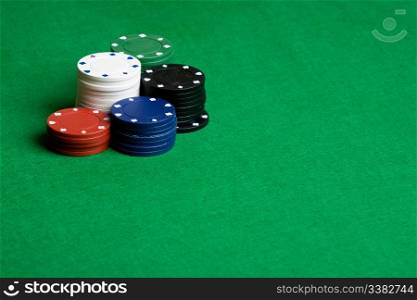 A background with poker chips and green felt