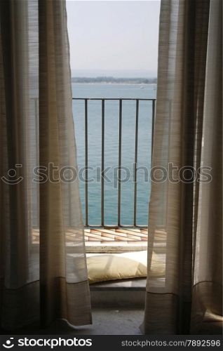 a Balcony an the seaside in the old Town of Siracusa in Sicily in south Italy in Europe.