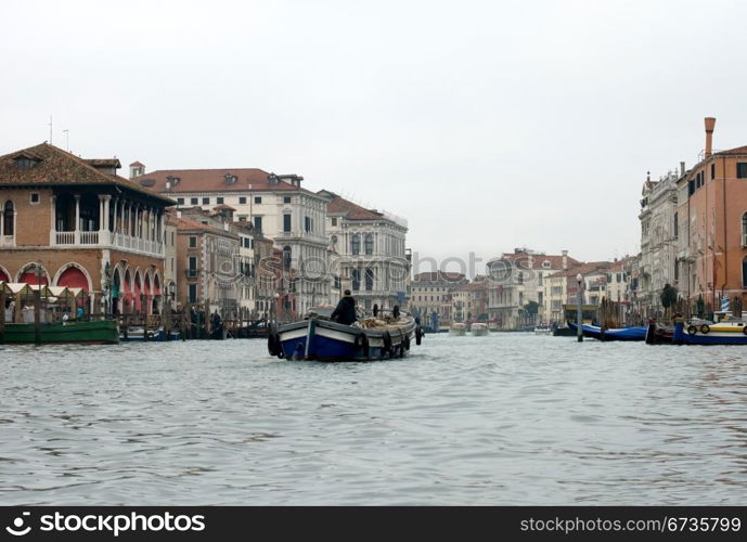 A barge travelling on the Grand Canal, Venice, Italy