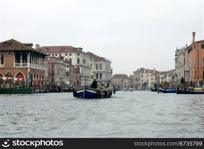 A barge travelling on the Grand Canal, Venice, Italy