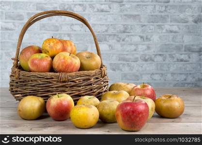 a basket of apples on the wooden table