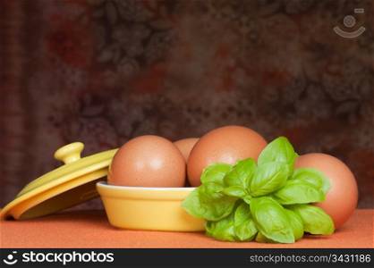 A basket of fresh eggs with orange background
