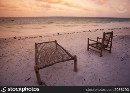 a Beach Chair at a Restaurant and Guesthouse on the Beach with the Landscape at the East Coast at the Village of Bwejuu on the Island of Zanzibar in Tanzania. Tanzania, Zanzibar, Bwejuu, October, 2004