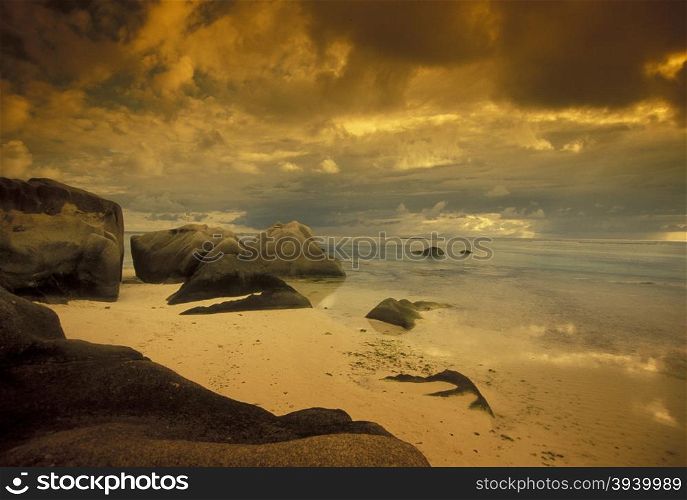 a Beach on the coast if the Island La Digue of the seychelles islands in the indian ocean. INDIAN OCEAN SEYCHELLES LA DIGUE BEACH