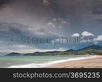 A beach with a mountain range