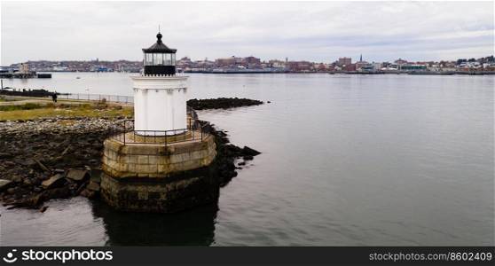 A beacon in Portland harbor warns mariners of dangerous rocks and surf on the Atlantic Ocean East Coast