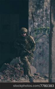 A bearded soldier in the uniform of special forces in dangerous military action in a dangerous enemy area. Selective focus. High-quality photo. A bearded soldier in uniform of special forces in a dangerous military action in a dangerous enemy area. Selective focus 