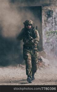 A bearded soldier in the uniform of special forces in dangerous military action in a dangerous enemy area. Selective focus. High-quality photo. A bearded soldier in uniform of special forces in a dangerous military action in a dangerous enemy area. Selective focus 