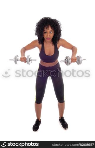 A beautiful African American girl working out with two dumbbell&rsquo;s inexercise outfit, isolated for white background.