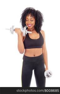 A beautiful African American girl working out with two dumbbell&rsquo;s inexercise outfit, isolated for white background, and smiling.