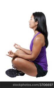 A beautiful Asian woman doing her Yoga lotus position execises