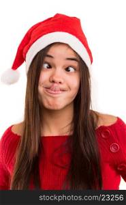 A beautiful asian woman with a christmas hat making a silly expression