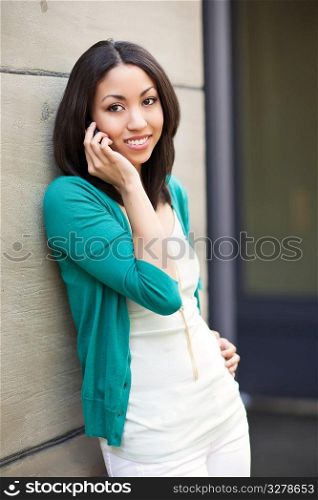 A beautiful black woman talking on her phone