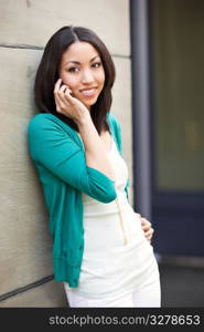 A beautiful black woman talking on her phone