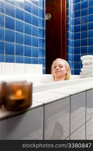 A beautiful blond caucasian female in a 1920&rsquo;s style bath and spa